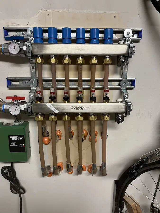 Plumber performing Water Heater Repair at a residential property in Reisterstown